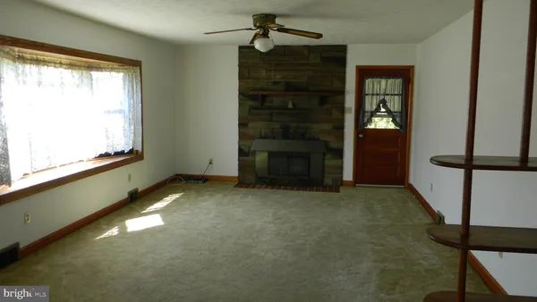 a view of a room that has a window in it