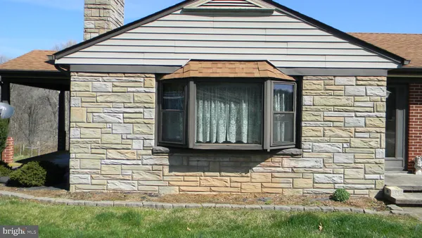 a front view of a house with garage