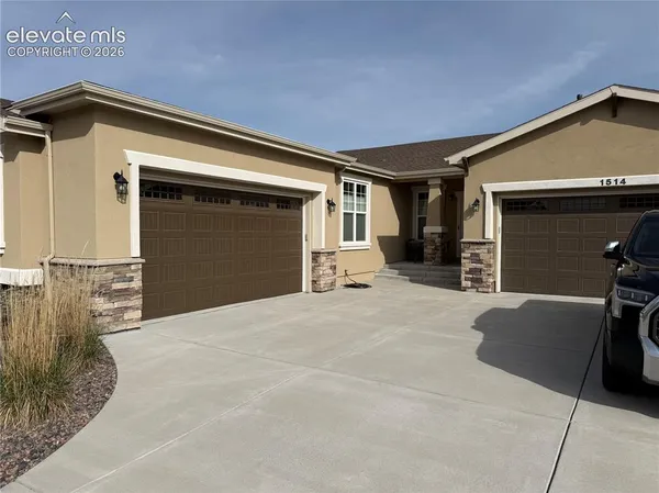 a front view of a house with a garage