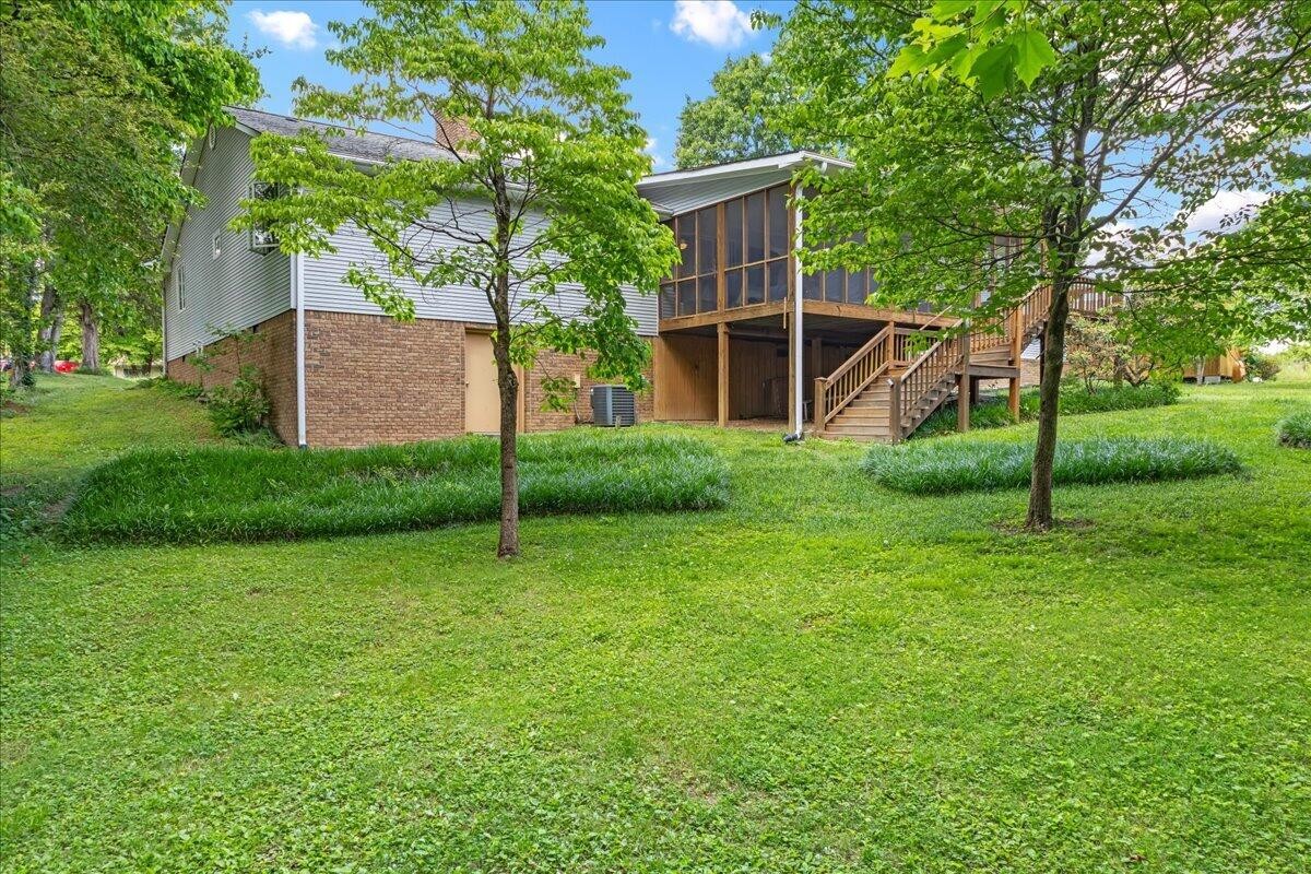 2522 Cindy Street Athens, TN 37303 - Photo 2 of 36 a view of a house with backyard and a tree