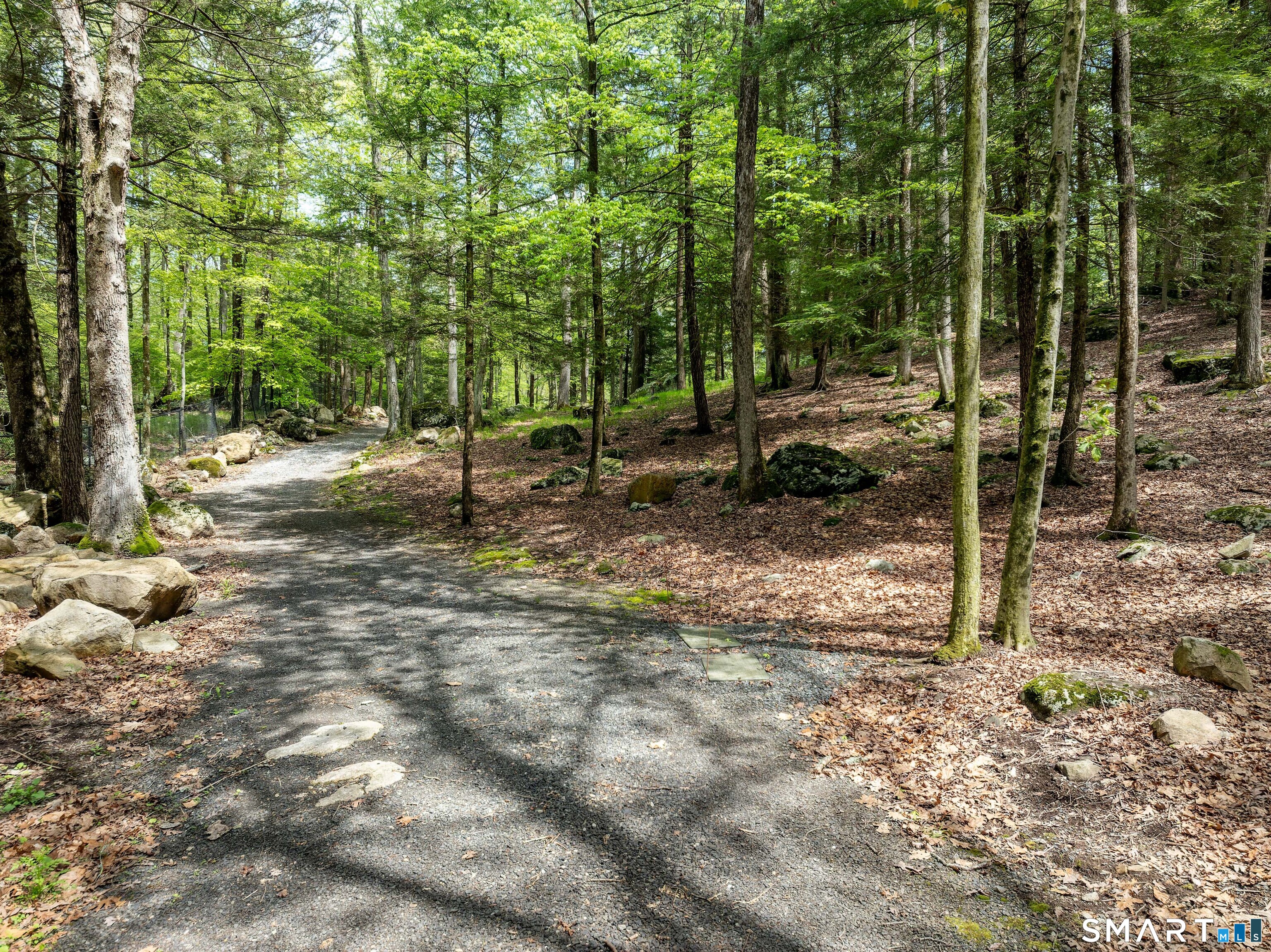 155 Long Ridge Road Danbury, CT 06810 - Photo 13 of 40 Approximately two miles of groomed trails extend through the property, encouraging walking, riding, and year-round exploration.