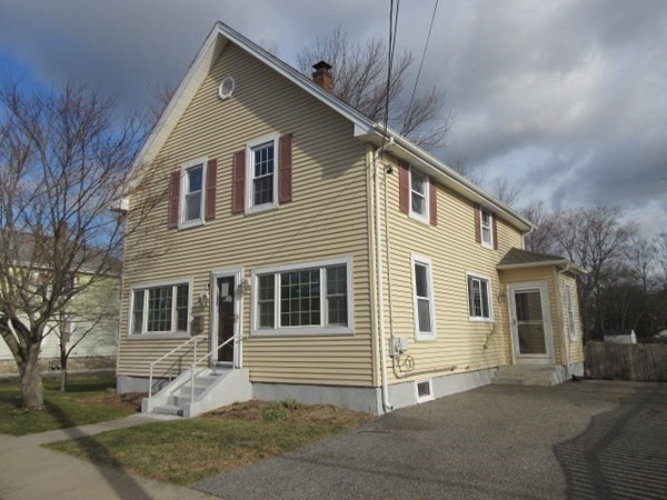 166 Knight Street Woonsocket, RI 02895 - Photo 1 of 22 a front view of a house with a yard