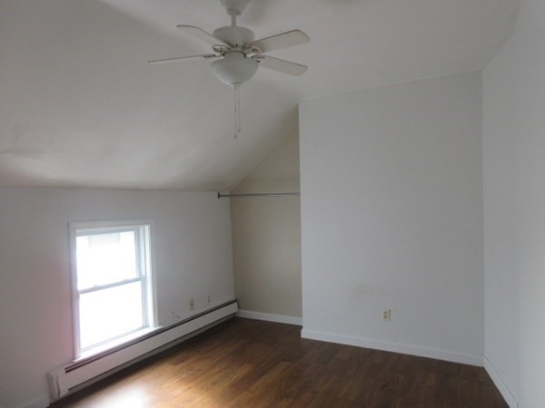 166 Knight Street Woonsocket, RI 02895 - Photo 11 of 22 an empty room with a window and a ceiling fan