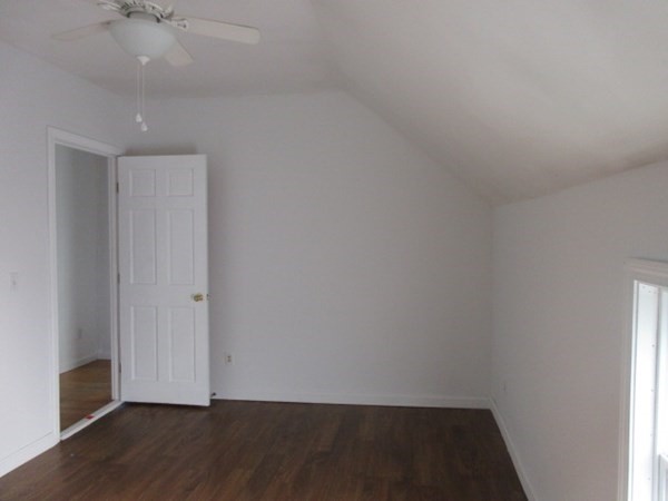166 Knight Street Woonsocket, RI 02895 - Photo 12 of 22 a view of an empty room with wooden floor and a window