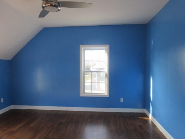 166 Knight Street Woonsocket, RI 02895 - Photo 15 of 22 a view of an empty room with wooden floor and a window