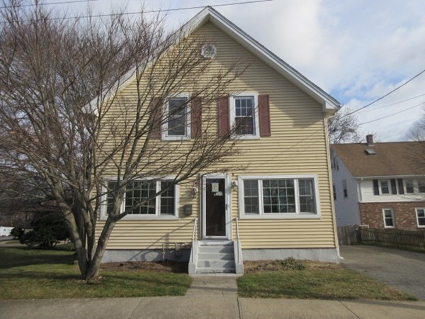 166 Knight Street Woonsocket, RI 02895 - Photo 2 of 22 a front view of a house with a yard