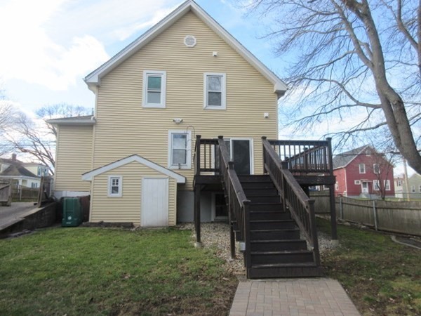 166 Knight Street Woonsocket, RI 02895 - Photo 21 of 22 a view of a house with backyard and trees