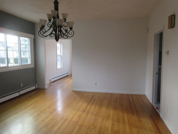 166 Knight Street Woonsocket, RI 02895 - Photo 7 of 22 wooden floor in an empty room with a window