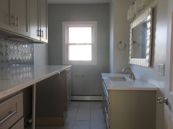 166 Knight Street Woonsocket, RI 02895 - Photo 9 of 22 a bathroom with a sink and a mirror