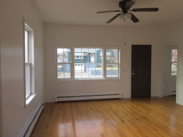 166 Knight Street Woonsocket, RI 02895 - Photo 10 of 22 a view of an empty room with wooden floor and a window