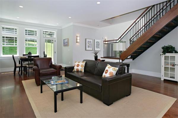 38 Hedge Road Brookline, MA 02445 - Photo 2 of 8 a living room with furniture and a dining table with wooden floor