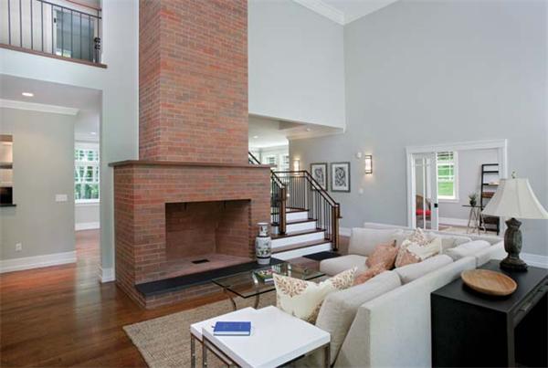 38 Hedge Road Brookline, MA 02445 - Photo 3 of 8 a living room with furniture and a fireplace