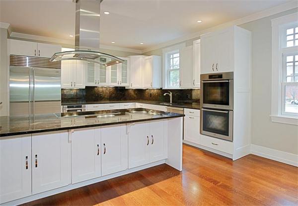 38 Hedge Road Brookline, MA 02445 - Photo 5 of 8 a kitchen with granite countertop a sink and steel stainless steel appliances