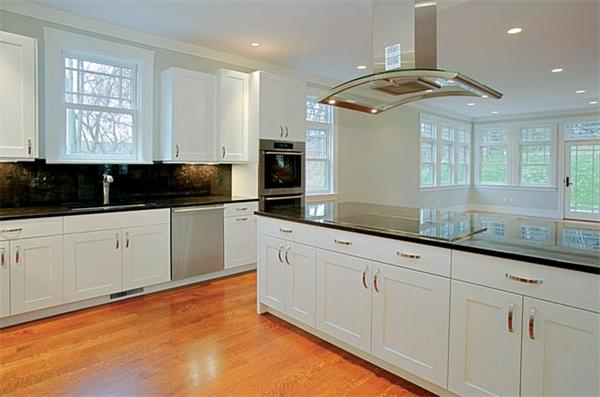 38 Hedge Road Brookline, MA 02445 - Photo 6 of 8 a kitchen with granite countertop a sink and cabinets