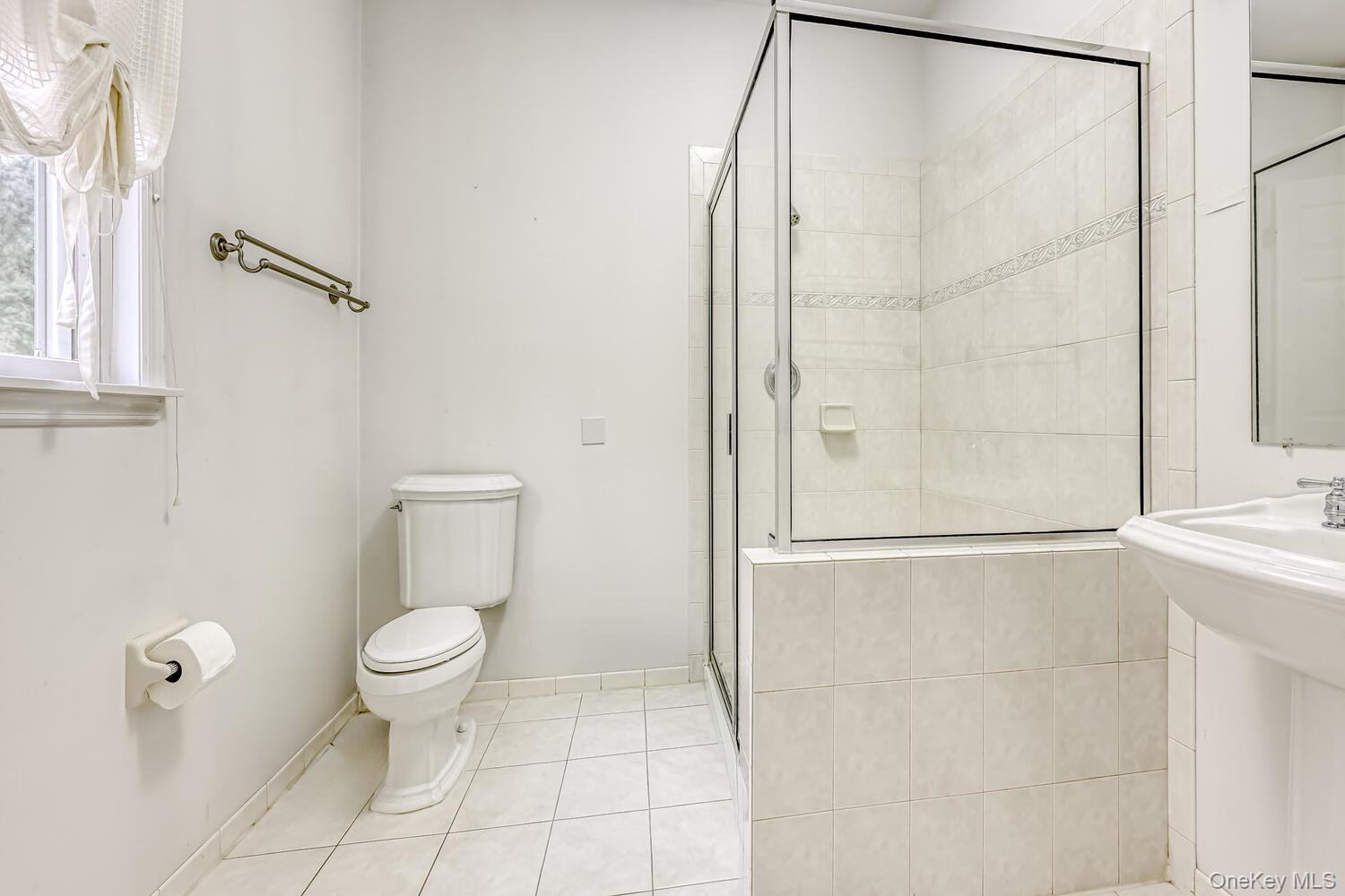 22 Golden Road Suffern, NY 10901 - Photo 21 of 41 Full bathroom featuring light tile patterned floors and a shower stall