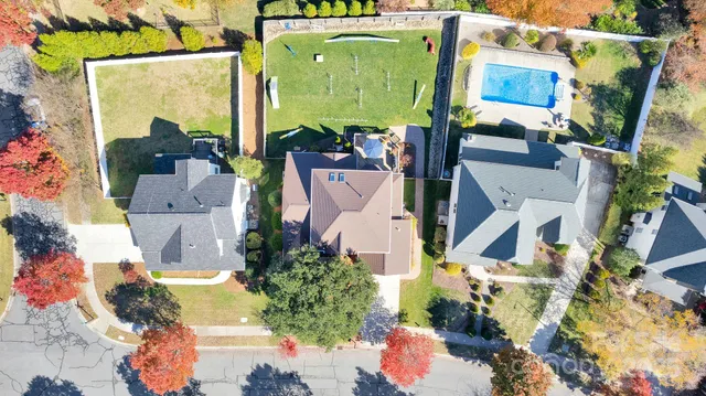 an aerial view of a house with a swimming pool