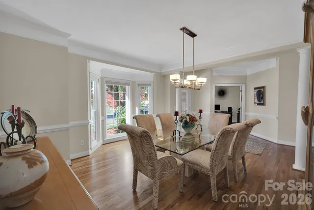a view of workspace with wooden floor and ceiling fan