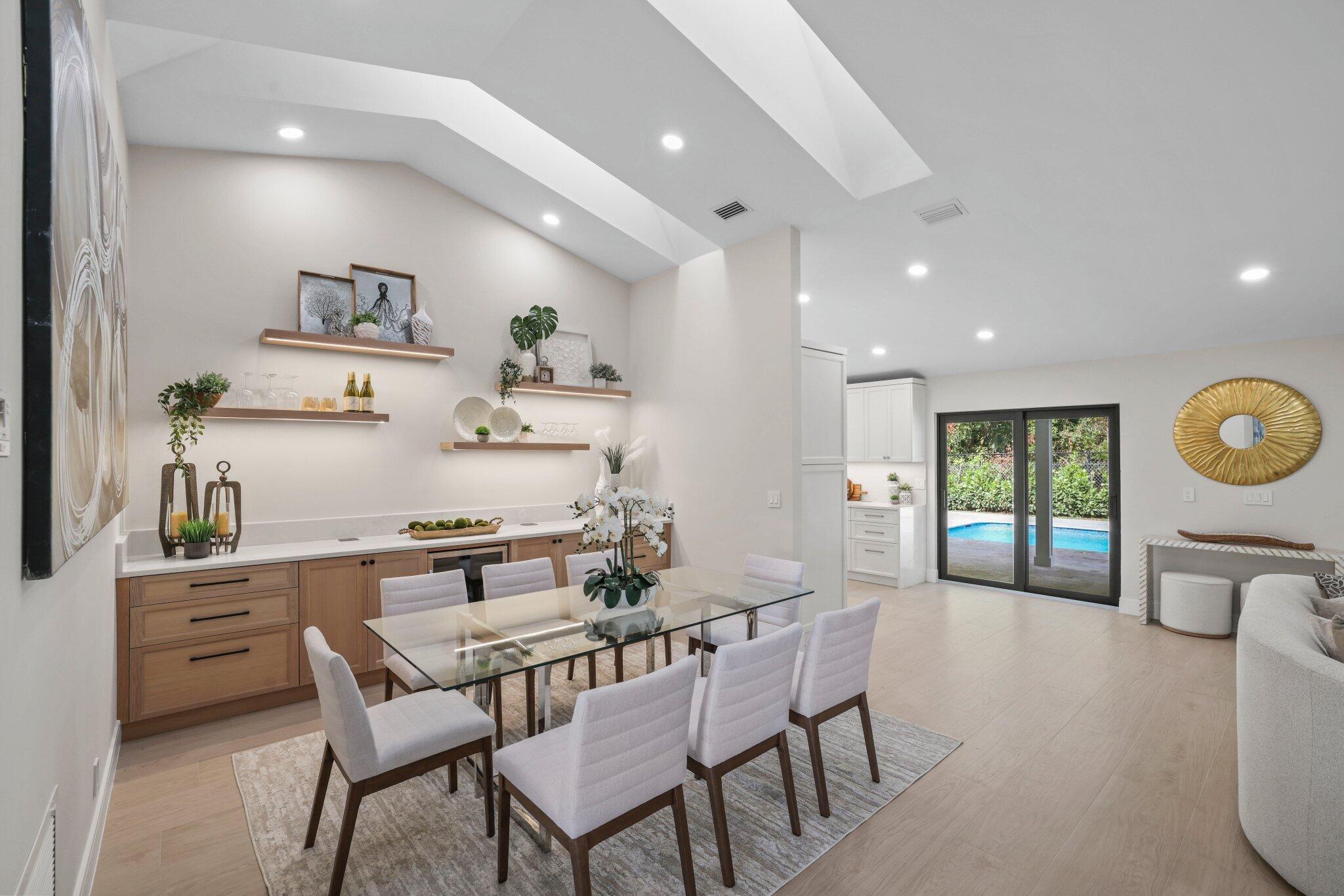 3901 Northwest 27th Avenue Boca Raton, FL 33434 - Photo 17 of 56 a kitchen with a table and chairs in it