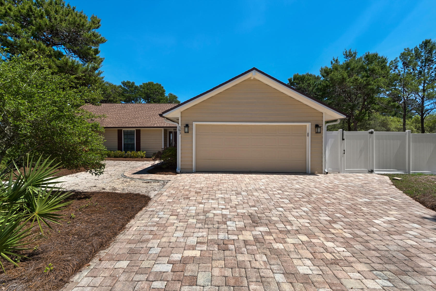 583 Ridge Road Santa Rosa Beach, FL 32459 - Photo 2 of 37 a front view of a house with a yard and trees
