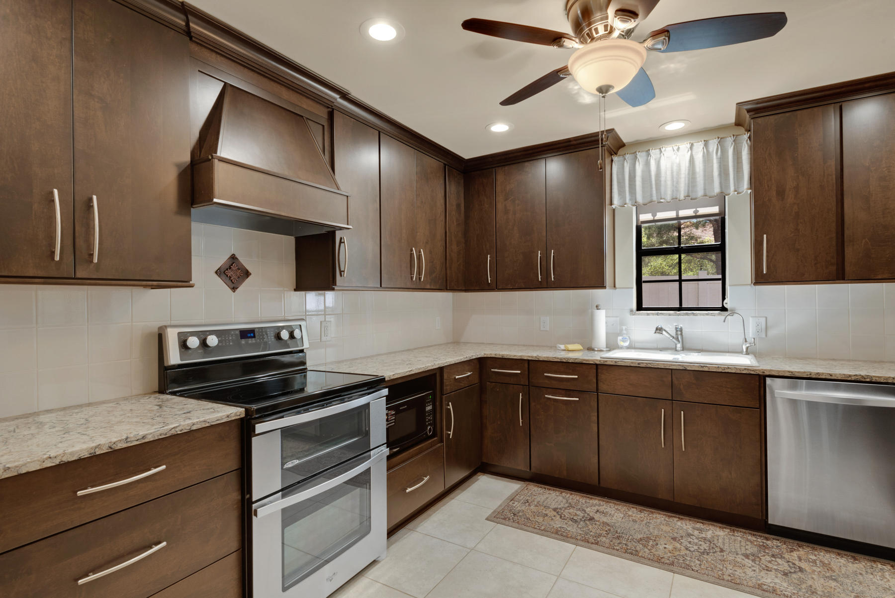583 Ridge Road Santa Rosa Beach, FL 32459 - Photo 13 of 37 a kitchen with a sink cabinets and stainless steel appliances
