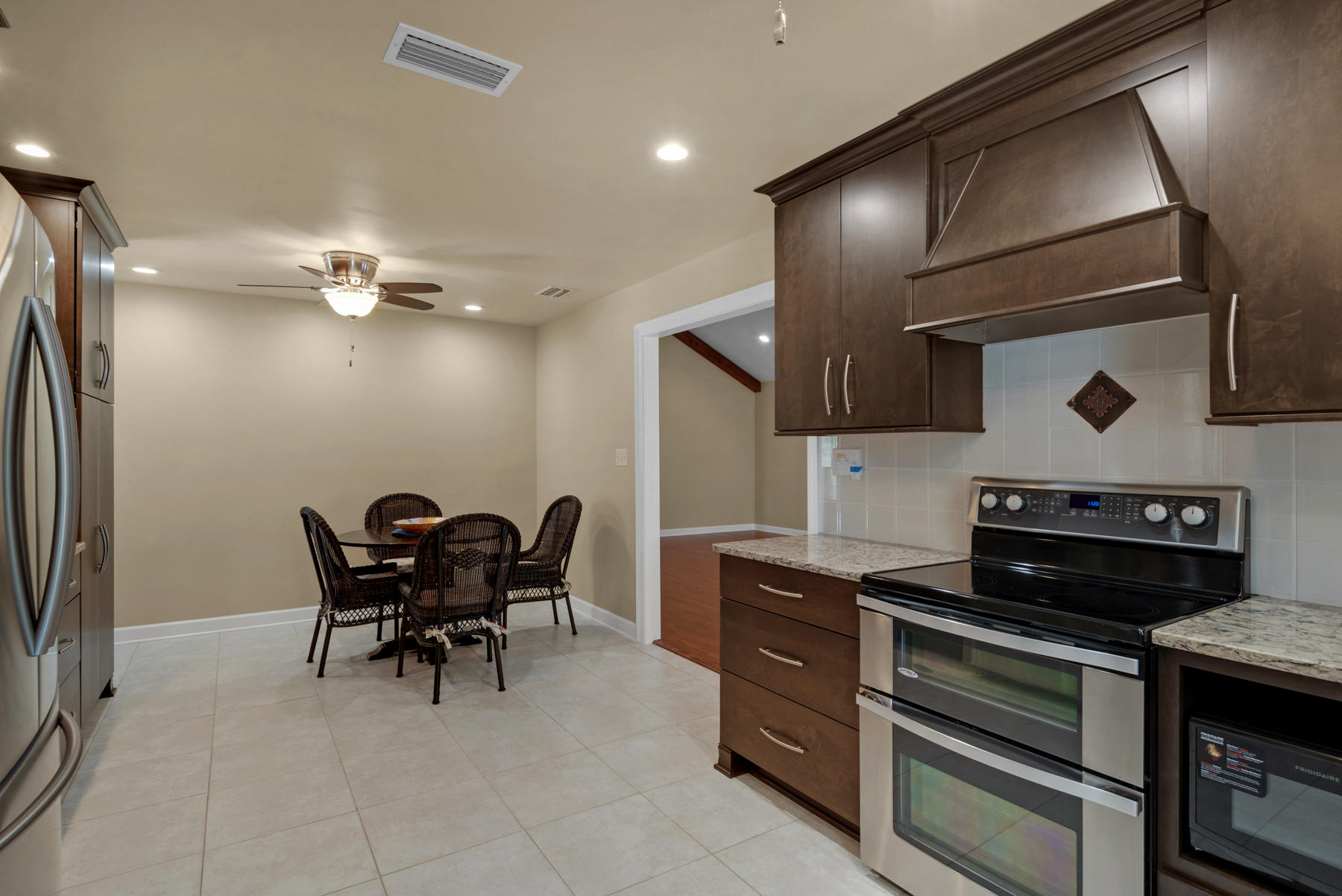 583 Ridge Road Santa Rosa Beach, FL 32459 - Photo 14 of 37 a kitchen with a stove and chairs
