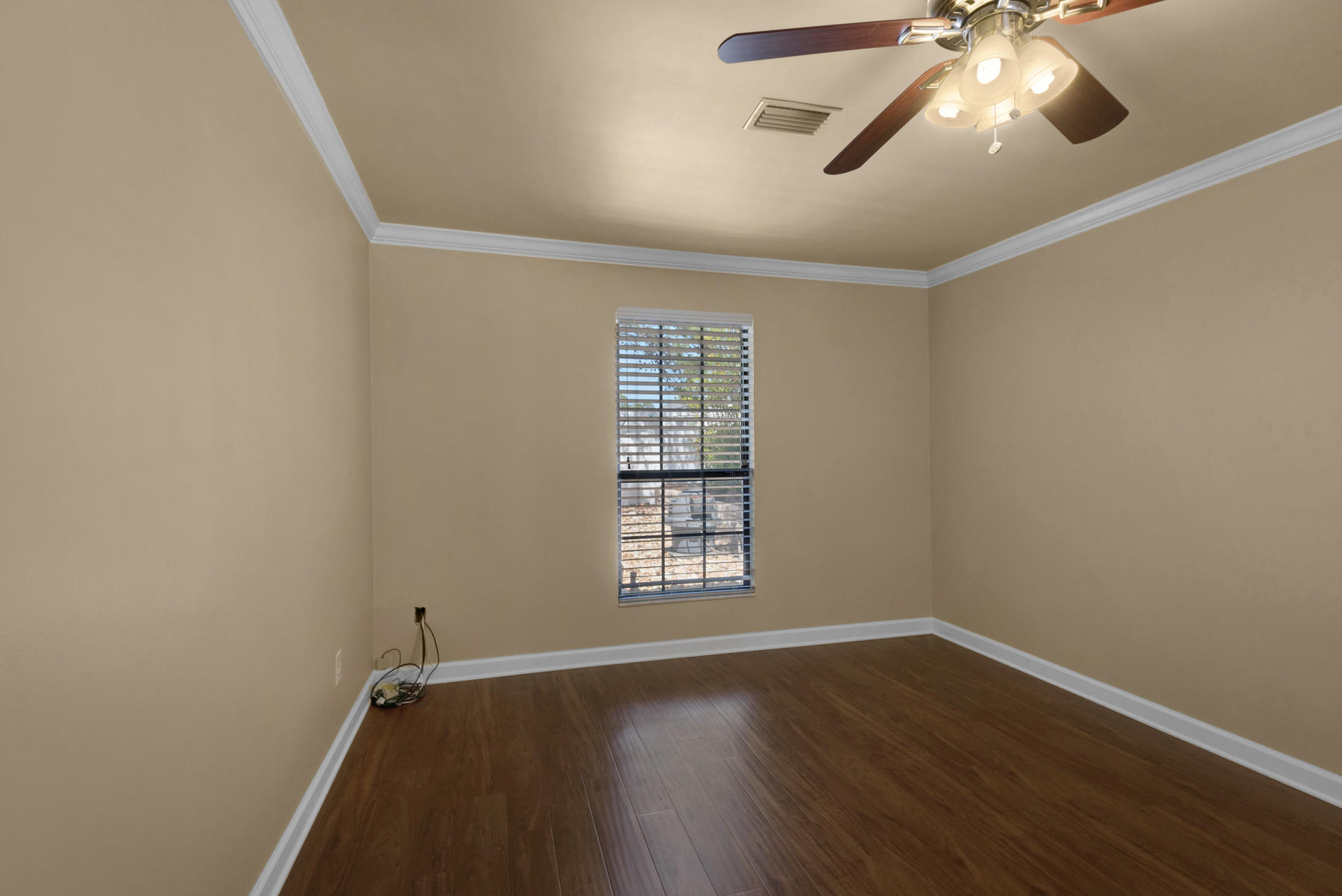583 Ridge Road Santa Rosa Beach, FL 32459 - Photo 15 of 37 wooden floor in an empty room with a window