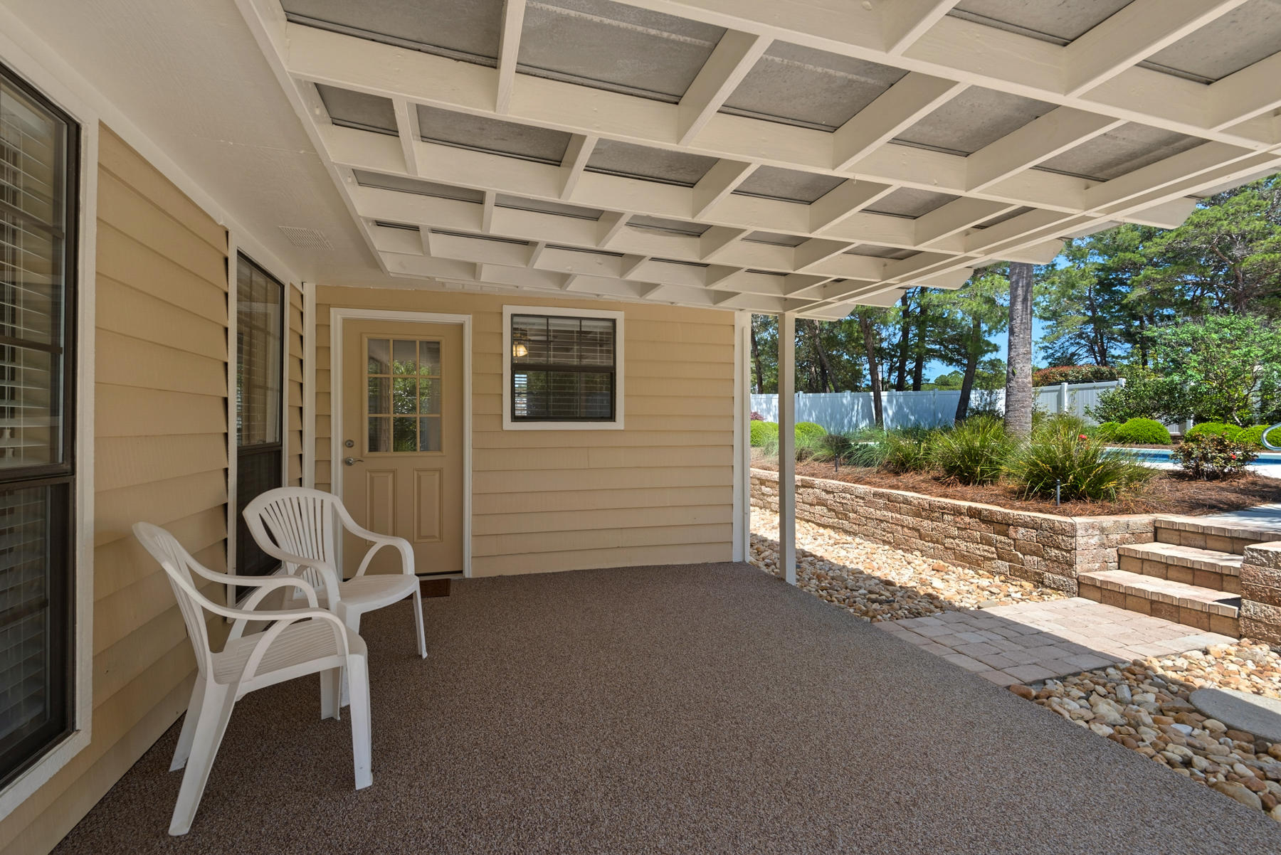 583 Ridge Road Santa Rosa Beach, FL 32459 - Photo 30 of 37 a view of a room with chairs and table in a patio