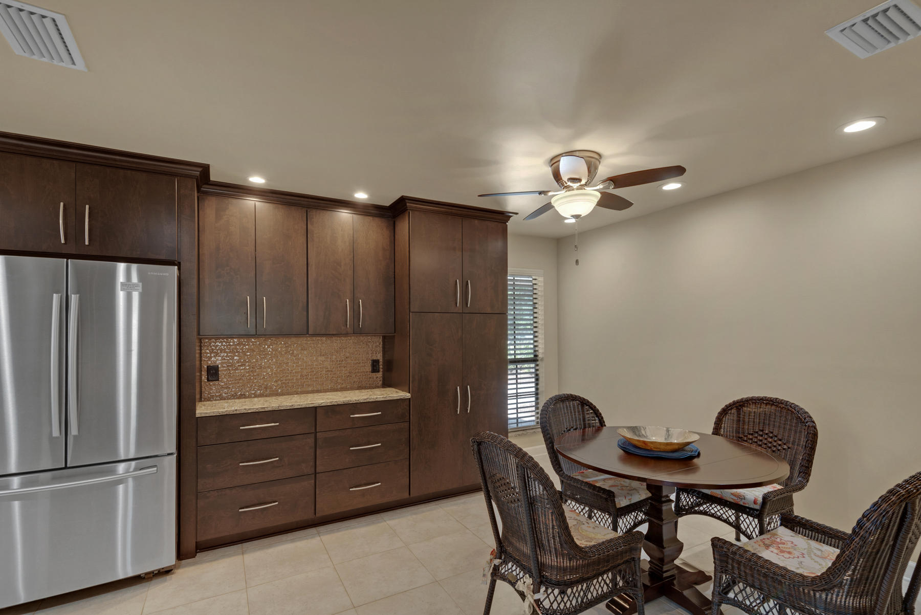 583 Ridge Road Santa Rosa Beach, FL 32459 - Photo 9 of 37 a kitchen with a table chairs and refrigerator