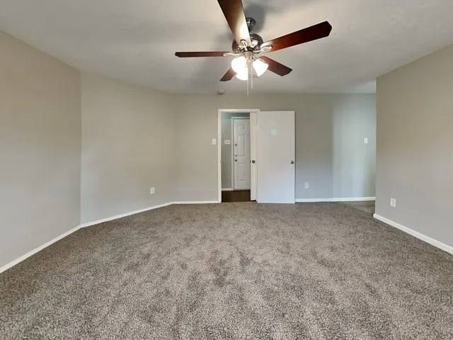 a view of a big room with carpet