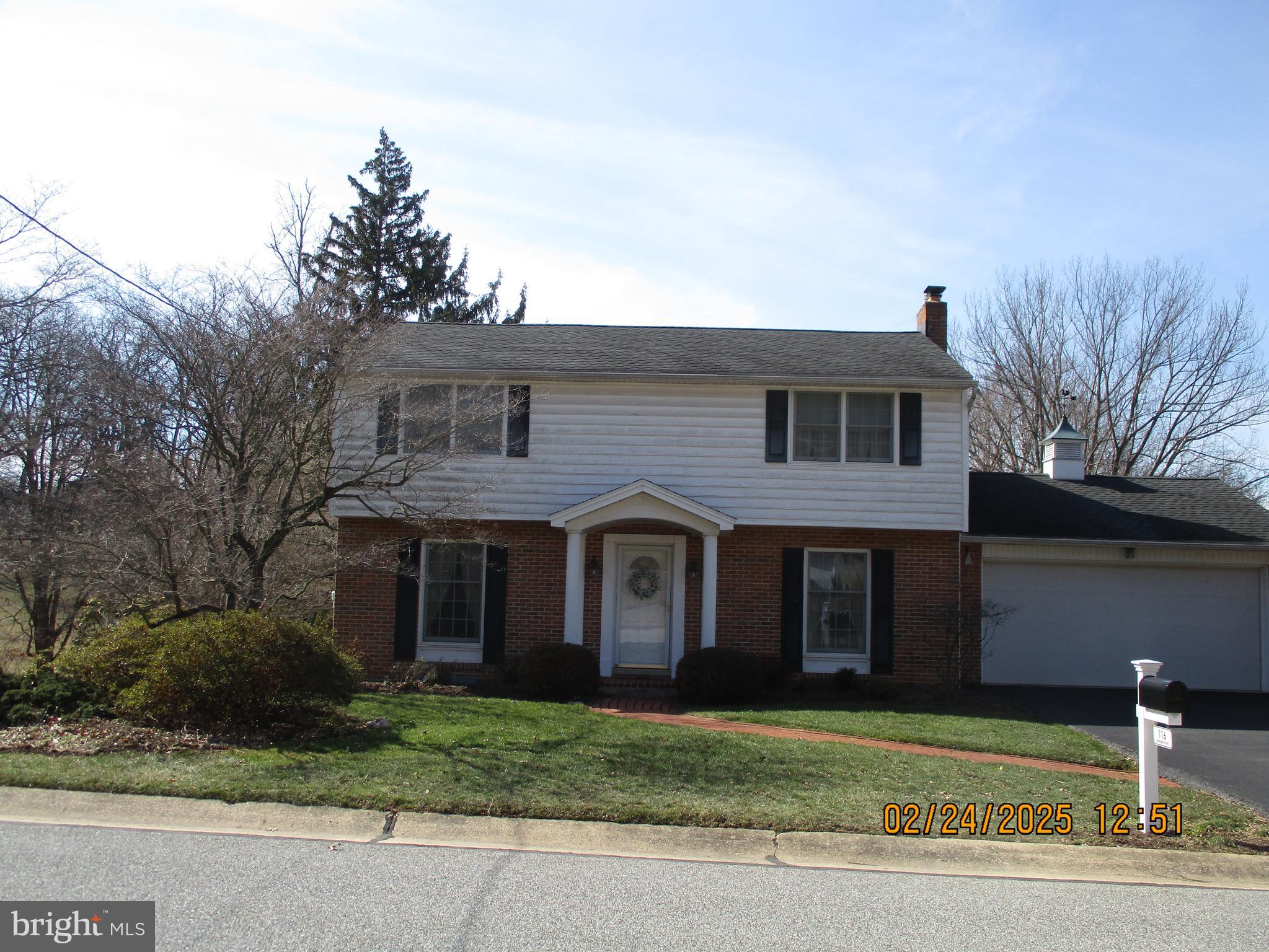116 Lexington Road York, PA 17402 - Photo 1 of 69 a view of a brick house with a yard plants and large tree