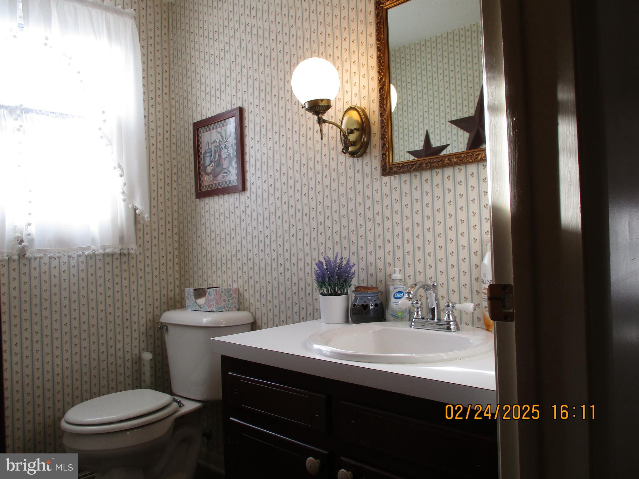 116 Lexington Road York, PA 17402 - Photo 15 of 69 a bathroom with a sink mirror vanity and toilet