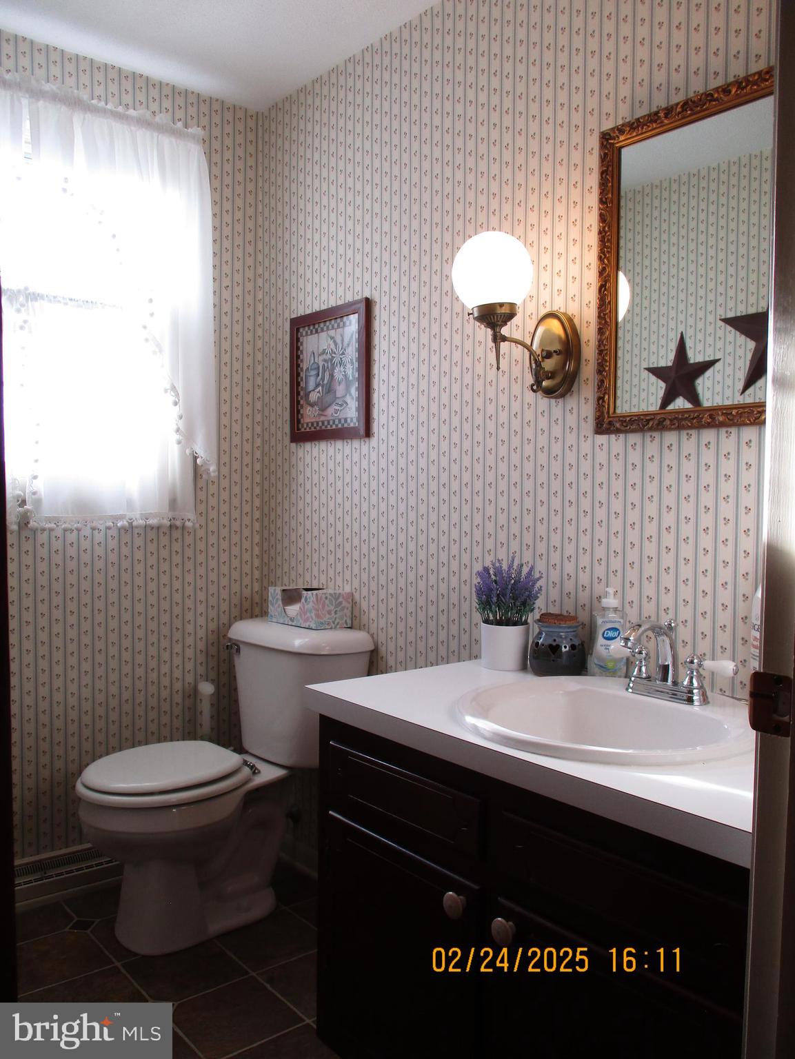 116 Lexington Road York, PA 17402 - Photo 16 of 69 a bathroom with a sink toilet and a mirror