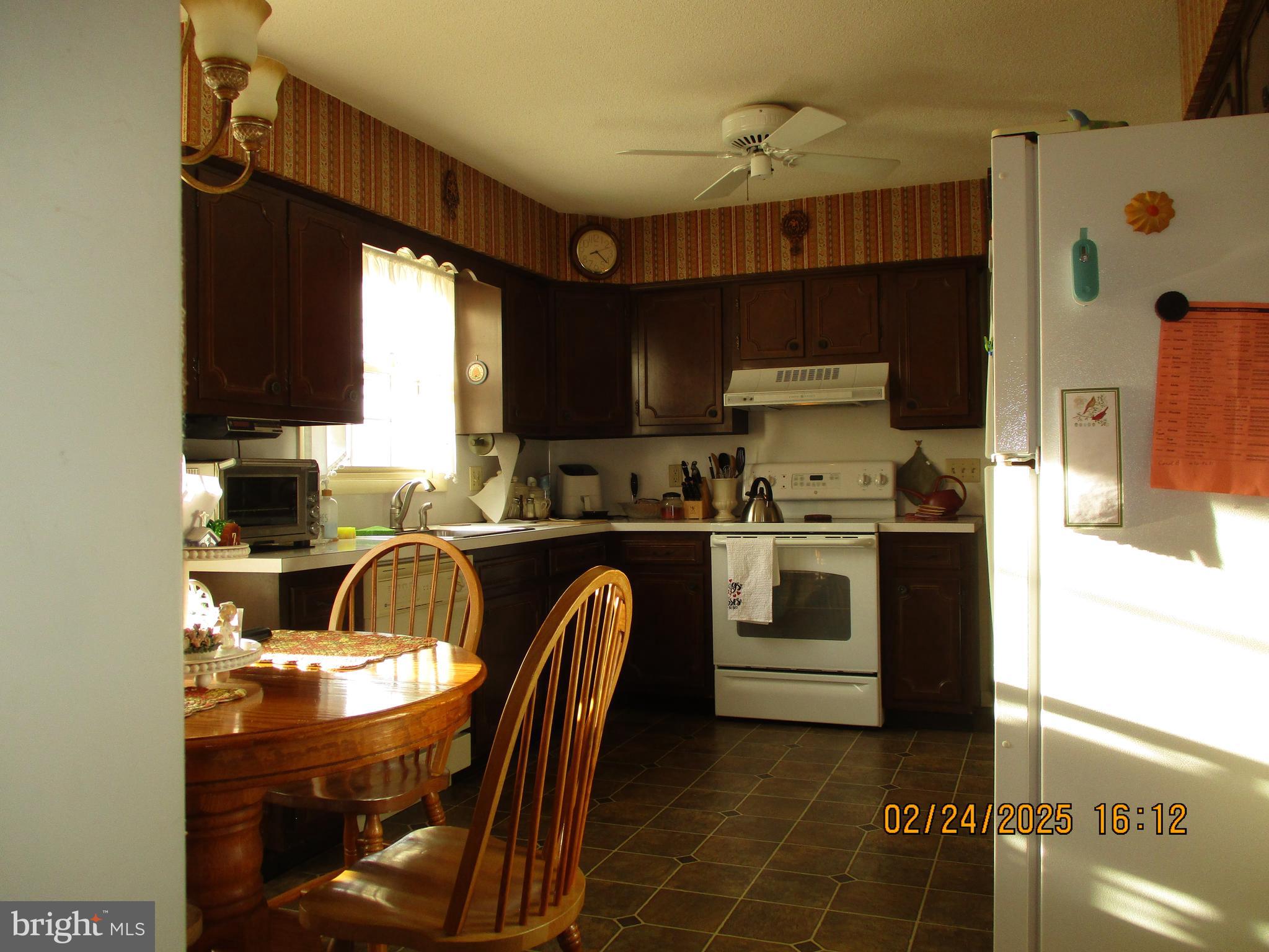 116 Lexington Road York, PA 17402 - Photo 17 of 69 a kitchen with a stove a refrigerator and a sink