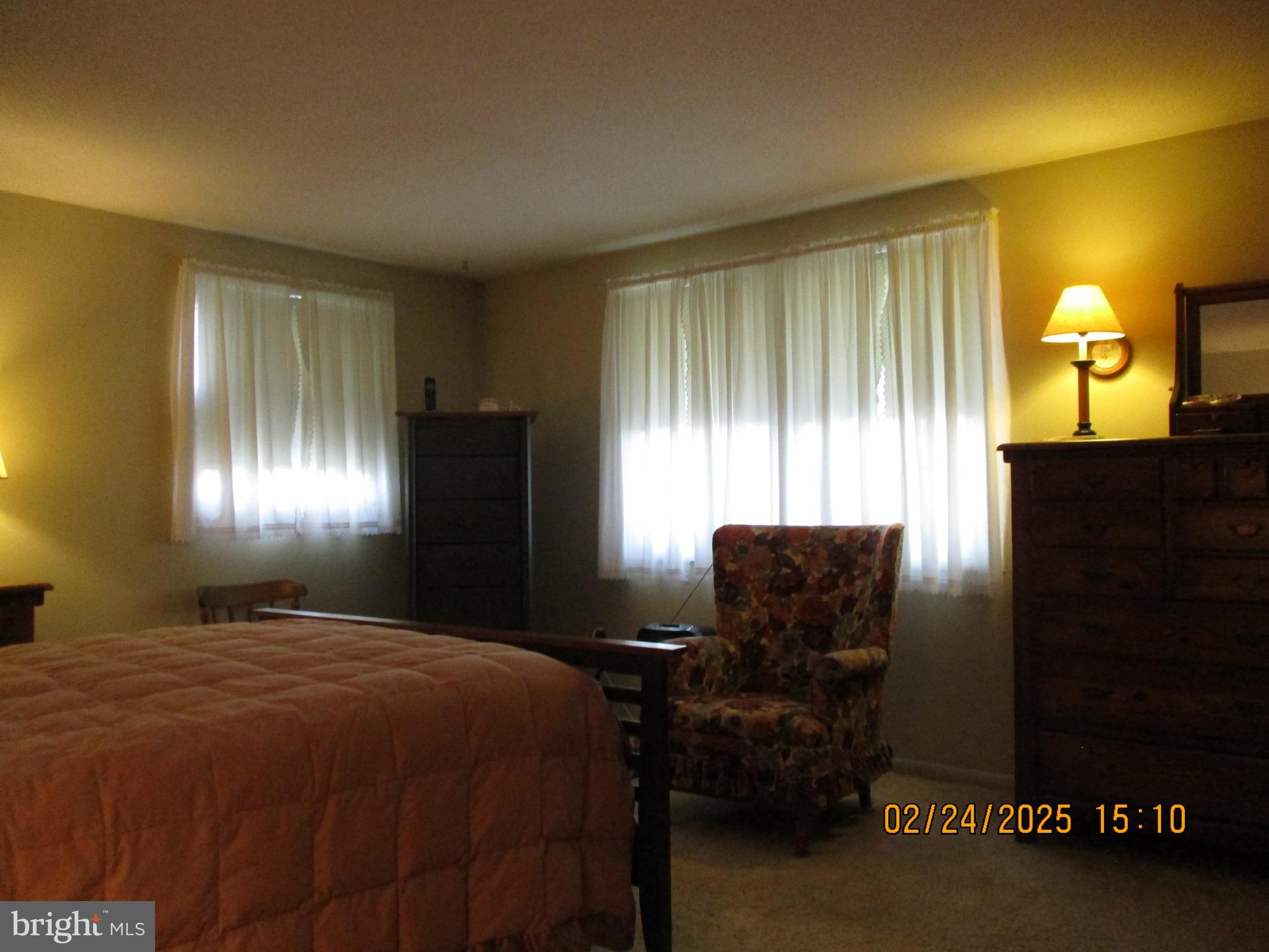 116 Lexington Road York, PA 17402 - Photo 20 of 69 a bedroom with a bed and a lamp with window