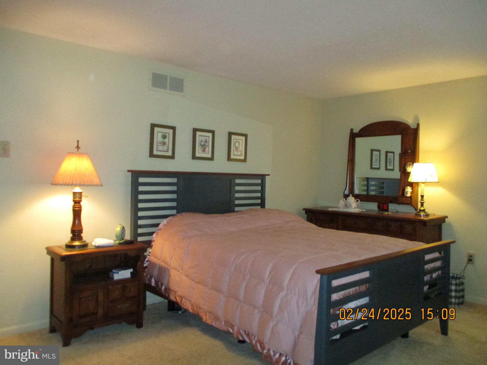 116 Lexington Road York, PA 17402 - Photo 21 of 69 a bedroom with a bed and a lamp on table