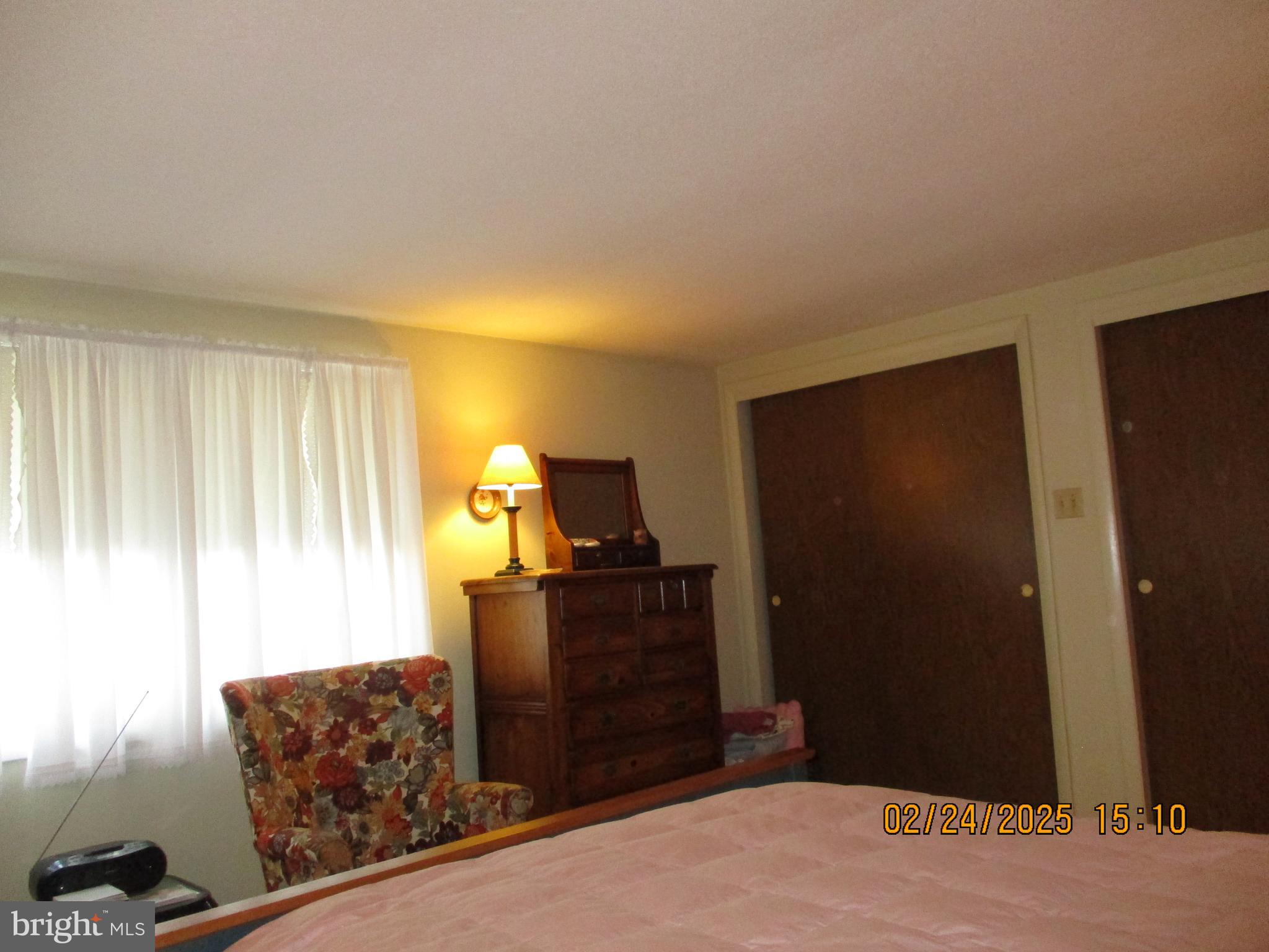 116 Lexington Road York, PA 17402 - Photo 22 of 69 a bedroom with a bed and wooden floor