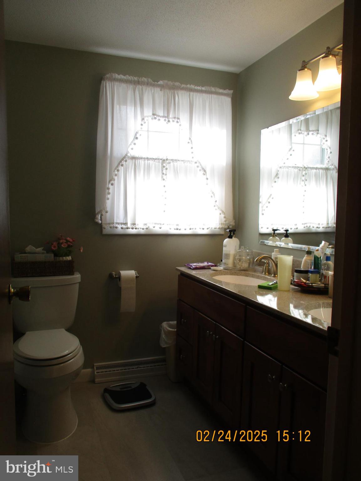 116 Lexington Road York, PA 17402 - Photo 30 of 69 a bathroom with a sink a toilet and a window