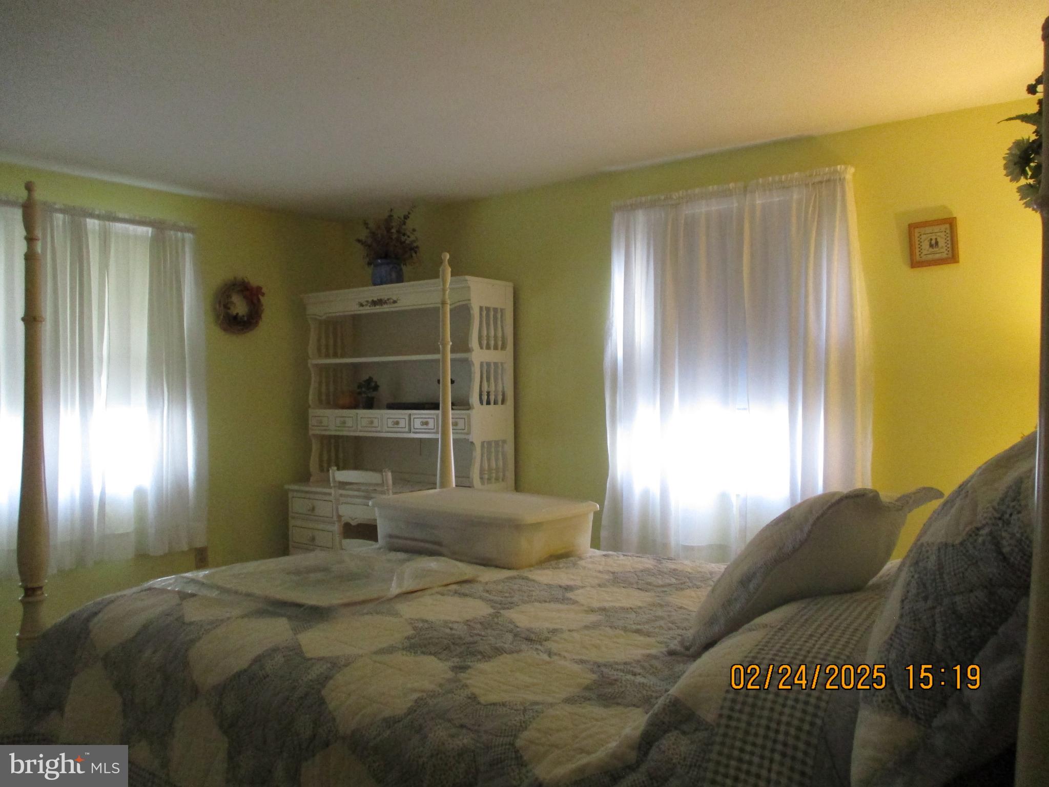 116 Lexington Road York, PA 17402 - Photo 34 of 69 a bedroom with a bed and closet with mirror