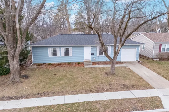 front view of a house with a yard