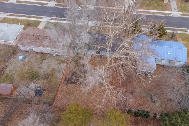 a aerial view of a house with a yard