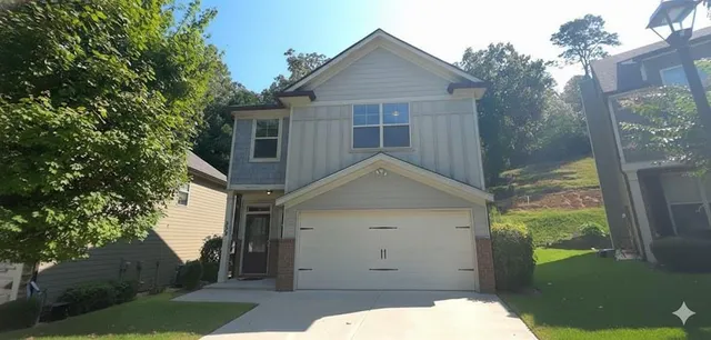 a front view of a house with a yard