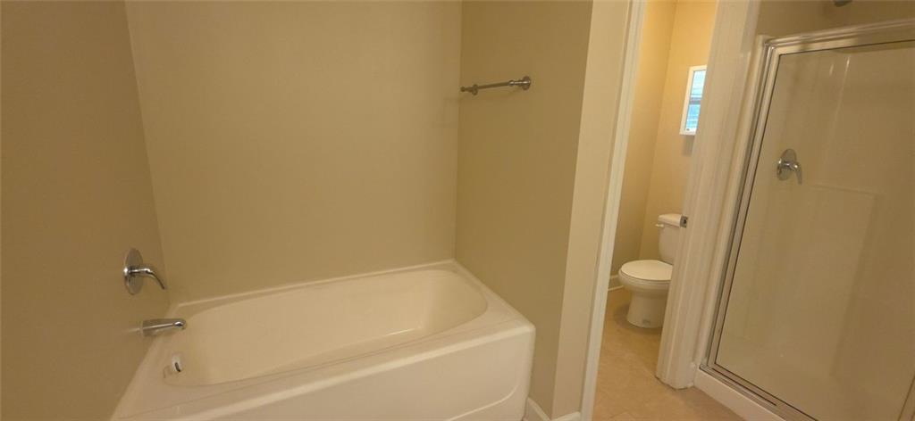 539 Broughton Drive Canton, GA 30114 - Photo 11 of 14 a bathroom with a bathtub