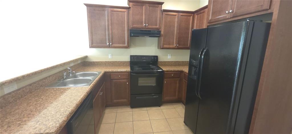 539 Broughton Drive Canton, GA 30114 - Photo 3 of 14 a kitchen with granite countertop a refrigerator and a stove