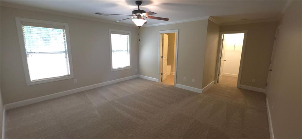 539 Broughton Drive Canton, GA 30114 - Photo 9 of 14 an empty room with windows and fan