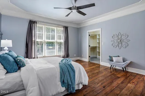 a bed room with a bed and a window