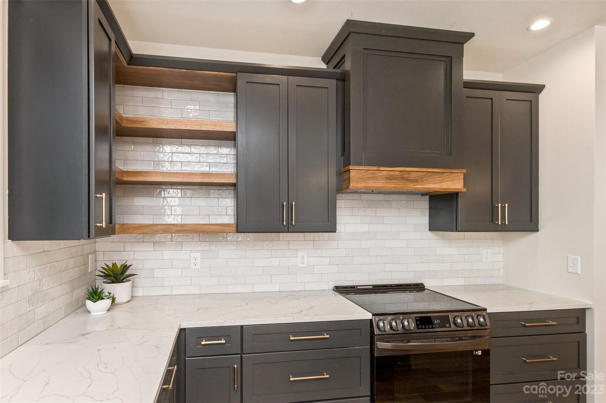 159 Gashes Creek Road Asheville, NC 28805 - Photo 11 of 48 a kitchen with cabinets and appliances