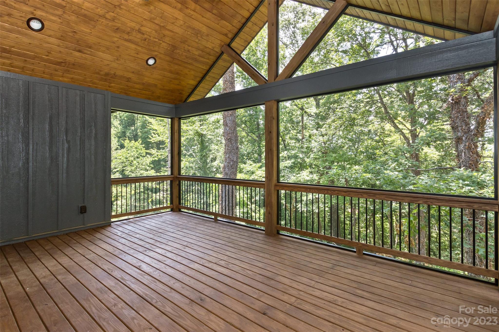 159 Gashes Creek Road Asheville, NC 28805 - Photo 18 of 48 a view of a porch with wooden floor in front of a house