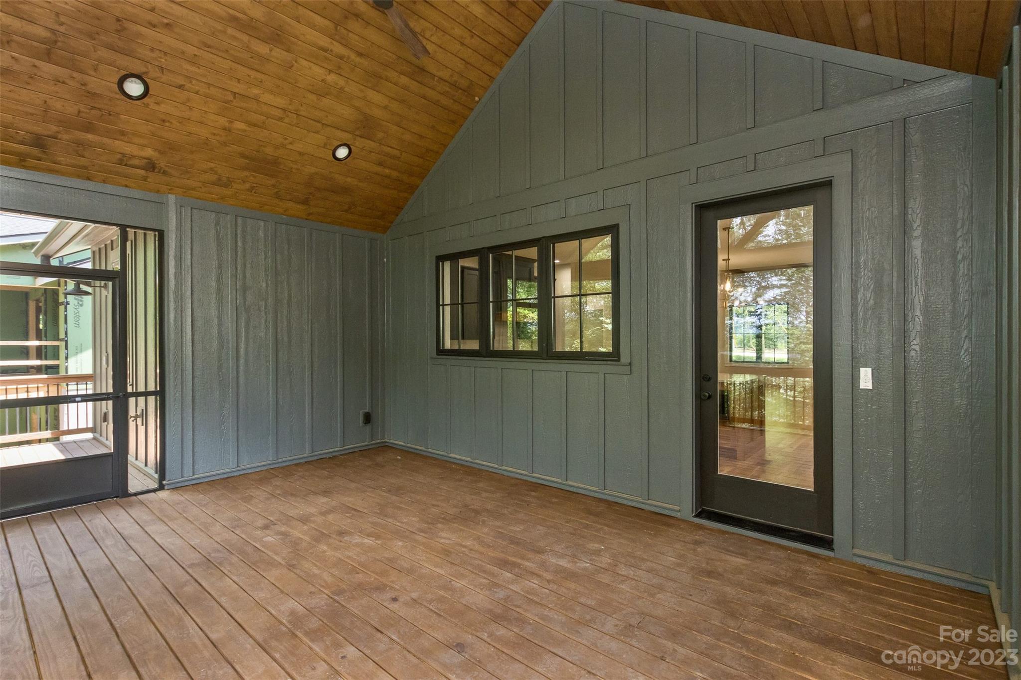 159 Gashes Creek Road Asheville, NC 28805 - Photo 20 of 48 a view of an empty room with wooden floor and a window