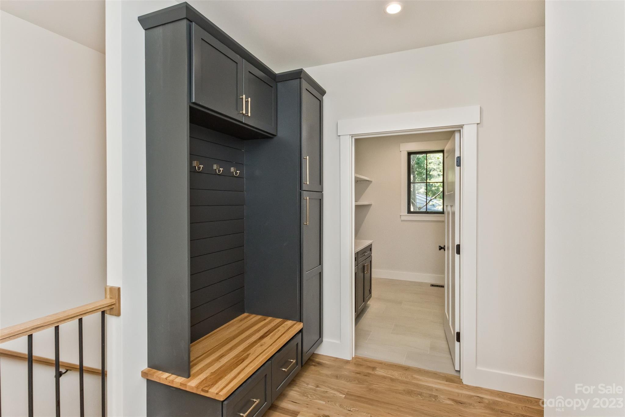 159 Gashes Creek Road Asheville, NC 28805 - Photo 21 of 48 a view of a hallway with wooden floor and a bathroom