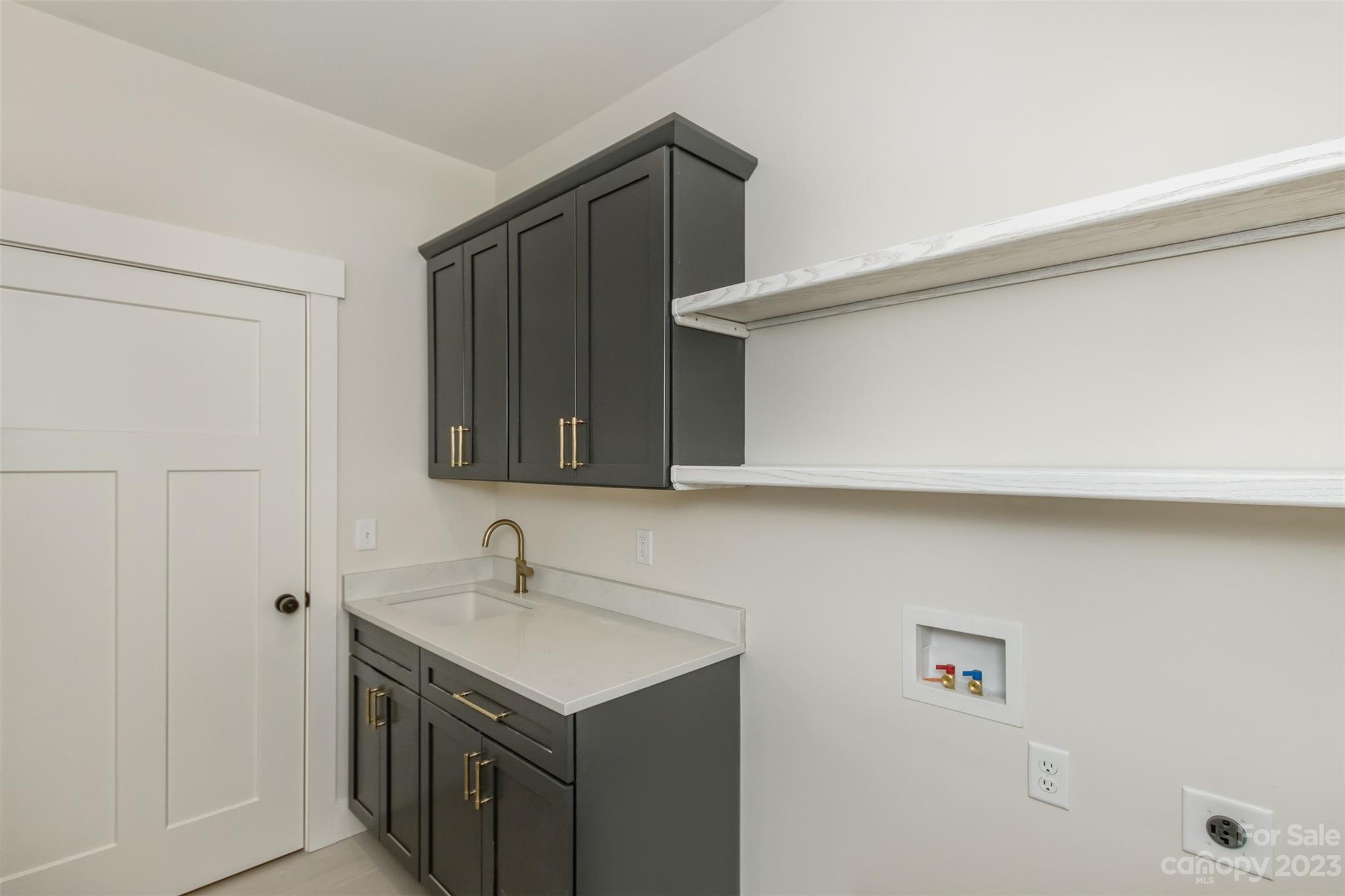159 Gashes Creek Road Asheville, NC 28805 - Photo 24 of 48 a kitchen with a sink and cabinets